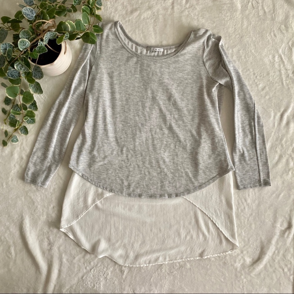 EZRA gray sweater with white blouse underneath